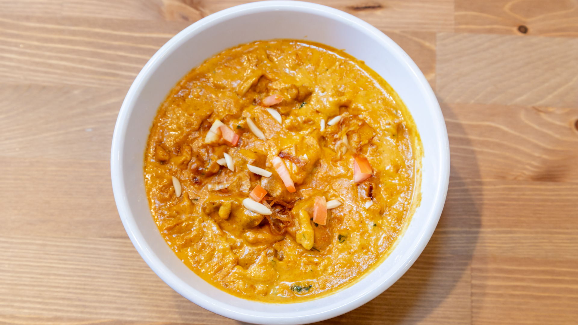 Sundara butter chicken in a rich golden tomato sauce