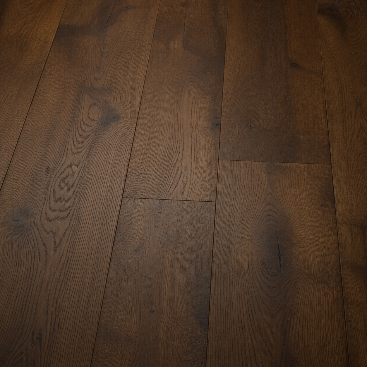 Close-up of smoked oak plank flooring used throughout the Sundara dining room