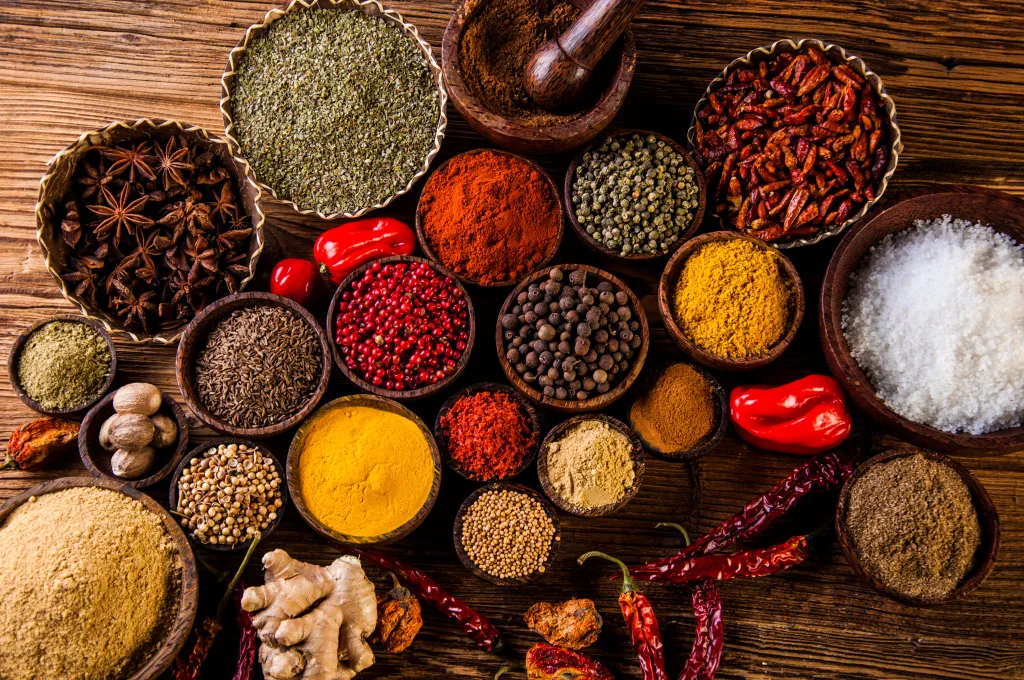 A colorful collection of Indian spices and aromatics